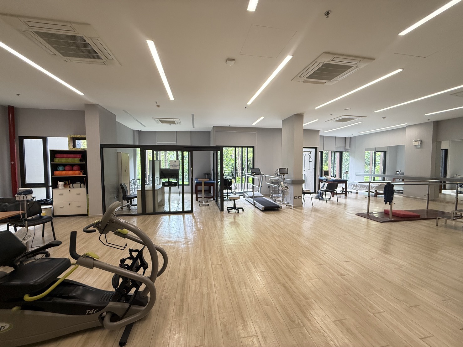 Wide indoor walking corridor inside the Sanpiti Rangsit rehabilitation department